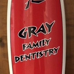 Nowell Gray, DDS - Gray Family Dentistry - One Dr. Gray's old surf boards. The latest dental skills and technology are not the only thing he brought along with from CA to the Ville!