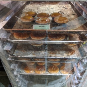 Aroma Bakery - Chinese egg tarts (on top) and Chinese wife cakes (on the bottom tray). - Bakeries Near Me - Toronto, Ontario