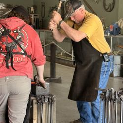 Circle Bar T Forge & Bladeworks - Working on the knife.