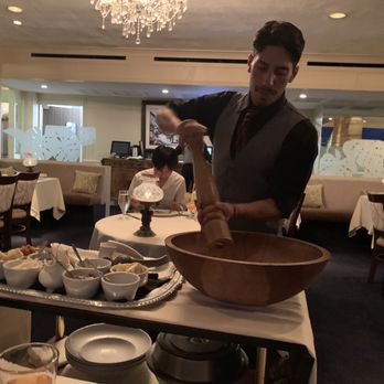 Michel's At The Colony Surf - Tableside preparation of Caesar salad. - French Near Me - Honolulu, Hawaii