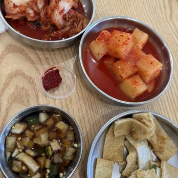 Myung Ga Haejangguk - Banchans- kimchi, pickled cubed radish, fish cakes, and onion and soy sauce/dip. - Korean Near Me - Arcadia, California Myung Ga Haejangguk - Banchans- kimchi, pickled cubed radish, fish cakes, and onion and soy sauce/dip. - Korean Near Me - Arcadia, California