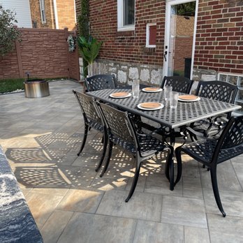 Green Operations - a patio with a table and chairs - Landscaping Near Me Green Operations - a patio with a table and chairs - Landscaping Near Me
