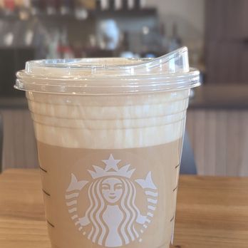 Starbucks - a cup of coffee on a table - Coffee & Tea Near Me - Roseville, California Starbucks - a cup of coffee on a table - Coffee & Tea Near Me - Roseville, California