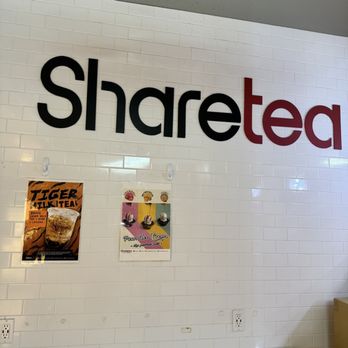 Sharetea - a sign for sharetea on the wall of a restaurant - Bubble Tea Near Me - Dallas, Texas