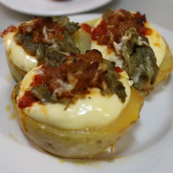 El Xampanyet - Don't know the name of this dish but we saw these at the bar, took a picture, and said we want whatever that is lol. Delicious! - Tapas Bars Near Me - Barcelona, B El Xampanyet - Don't know the name of this dish but we saw these at the bar, took a picture, and said we want whatever that is lol. Delicious! - Tapas Bars Near Me - Barcelona, B