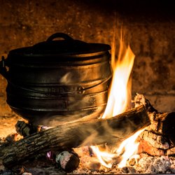 Hammer & Tongs - Traditional South African cooking methods at Hammer & Tongs. This is a Potjie and inside is Yellowtail, Squid, Mussels, Rice, Tomato & wine