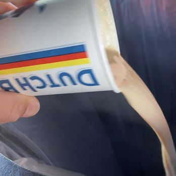 Dutch Bros Coffee - Full latte in trash. Not good at all. Very very weak, no much of a latte. - Coffee & Tea Near Me - Rio Rancho, New Mexico