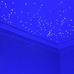Holos NYC - Star lights glow and fade away as you descend into the warm salt water.