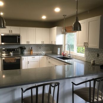 Kaiser & Kaiser - a kitchen with white cabinets and stainless steel appliances - General Contractors Near Me Kaiser & Kaiser - a kitchen with white cabinets and stainless steel appliances - General Contractors Near Me
