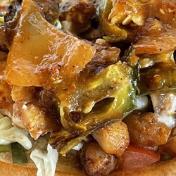 Taqueria Marissa - Opened the lid on the chicken torta.  Added the red sauce, onions, and peppers.
