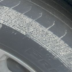 Budget Car & Truck Rental - Scary bald tire with cable visible