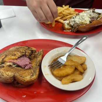 Dolly's Diner - Ruben with a side of baked apples and the signature Philly with fries. - Diners Near Me - Princeton, West Virginia Dolly's Diner - Ruben with a side of baked apples and the signature Philly with fries. - Diners Near Me - Princeton, West Virginia