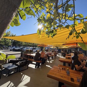Albi's - The yellow shade sails keep it cool while keeping a cheerful vibe - Wine Bars Near Me - Danville, California