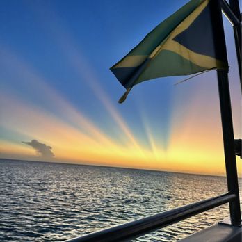 & We OUT! Travel Agency - Sunset, Jamaican flag - Travel Services Near Me & We OUT! Travel Agency - Sunset, Jamaican flag - Travel Services Near Me