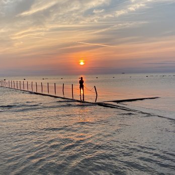 Fullerton Beach - Beautiful silhouette of a woman w/the breakwater & sunrise - Beaches Near Me - Chicago, Illinois Fullerton Beach - Beautiful silhouette of a woman w/the breakwater & sunrise - Beaches Near Me - Chicago, Illinois