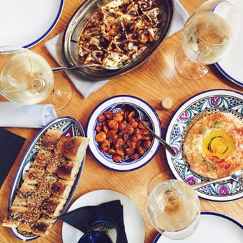 Byblos - Labneh with babari bread, marcona almonds, manti eggplant dumplings. - Mediterranean Near Me - Toronto, Ontario Byblos - Labneh with babari bread, marcona almonds, manti eggplant dumplings. - Mediterranean Near Me - Toronto, Ontario