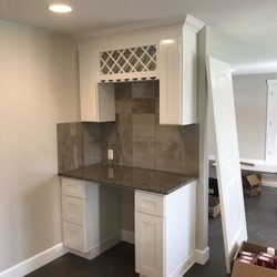 3SK Construction - Built in desk with win rack.