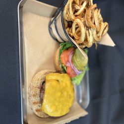 Revolutionary Wings - Brisket smash burger and house made curly fry
