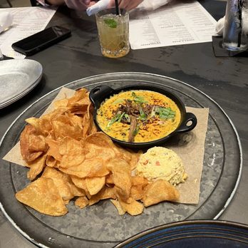 The Rustic - SMOKED DIP DUO was a cool and tasty appetizer! Comes in a smoke filled dome with homemade chips, yummy pimento cheese & queso - Bars Near Me - Houston, Texas
