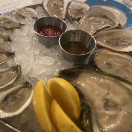 Raw oysters, the ones on the right are Sandy Necks. They are gigantic. Raw oysters, the ones on the right are Sandy Necks. They are gigantic.