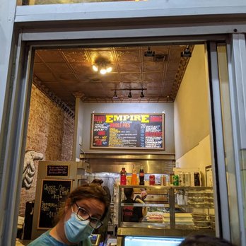 Empire Pizza & Pub - Take-out and order window, with menu in background - Pizza Near Me - Tucson, Arizona Empire Pizza & Pub - Take-out and order window, with menu in background - Pizza Near Me - Tucson, Arizona