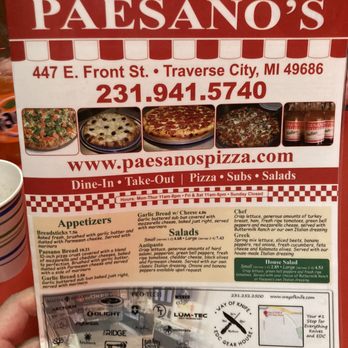 Paesano's Pizza - a hand holding a menu - Pizza Near Me - Traverse City, Michigan Paesano's Pizza - a hand holding a menu - Pizza Near Me - Traverse City, Michigan