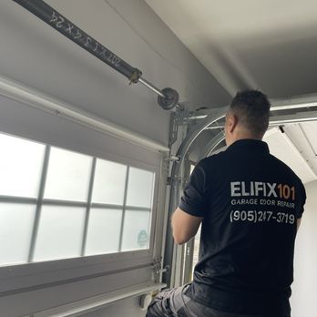 elifix101 - ELIFIX101 technician completing a garage door repair and inspection. - Garage Door Services Near Me