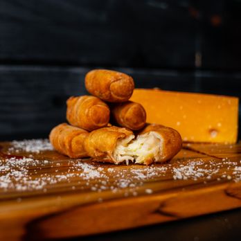 Barao’s Grill - a pile of doughnuts on a cutting board - Food Trucks Near Me - Orlando, Florida Barao’s Grill - a pile of doughnuts on a cutting board - Food Trucks Near Me - Orlando, Florida