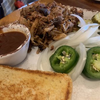 Wunsche Bros Cafe & Saloon - Smokey, tender and moist pulled pork with a bright, house-made bbq sauce on the side - will definitely satisfy your BBQ cravings. - Burgers Near Me - Spring, Texas