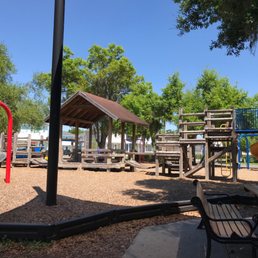 The primary structure in the playground is made of wood. The primary structure in the playground is made of wood.