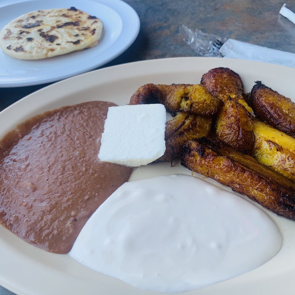 Platanos Fritos con queso y crema(Salvi sour cream) And a pupusa revuelta Platanos Fritos con queso y crema(Salvi sour cream) And a pupusa revuelta