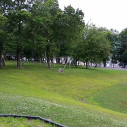Older playground equipment and basketball court