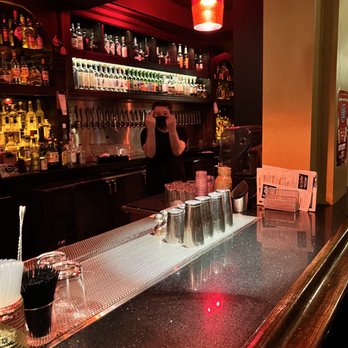 Bear Vs. Bull - Bartender sticking the middle finger up to my friend and I after I told him I was take photos for cursing us out. - Beer Bar Near Me - San Francisco, California