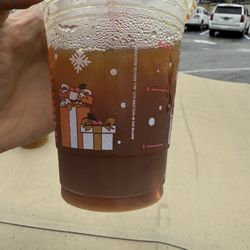 Dunkin' - Should be an iced caramel coffee with cream. Looks like coke.