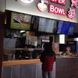 The front of the restaurant.  you can see the prices on the menu board a little bit