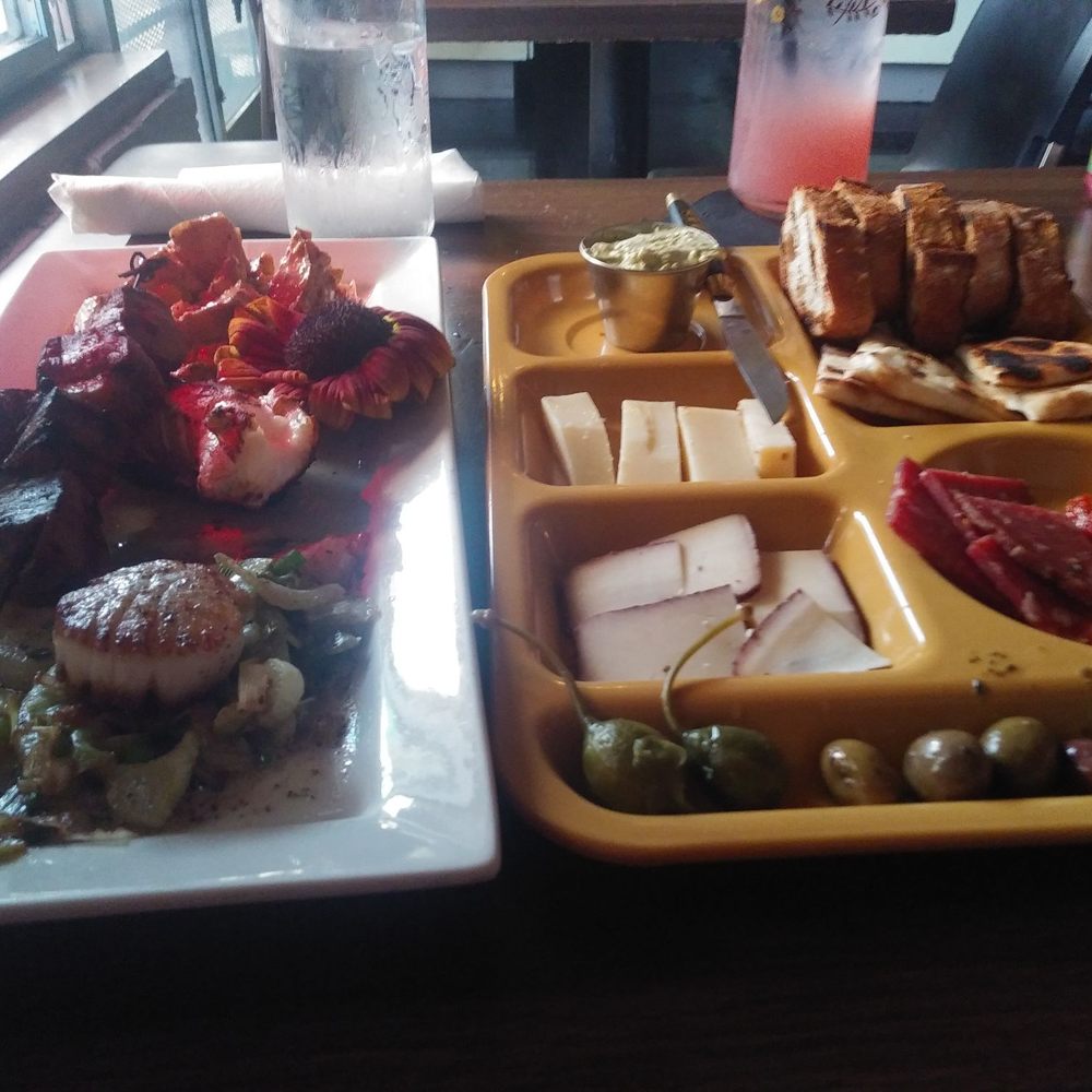 Suis Generis - Left is the confluence of the amur. Right is the meat and cheese plate. - New American Near Me - New Orleans, Louisiana Suis Generis - Left is the confluence of the amur. Right is the meat and cheese plate. - New American Near Me - New Orleans, Louisiana