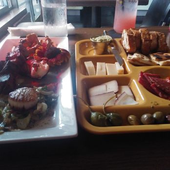 Suis Generis - Left is the confluence of the amur. Right is the meat and cheese plate. - New American Near Me - New Orleans, Louisiana Suis Generis - Left is the confluence of the amur. Right is the meat and cheese plate. - New American Near Me - New Orleans, Louisiana