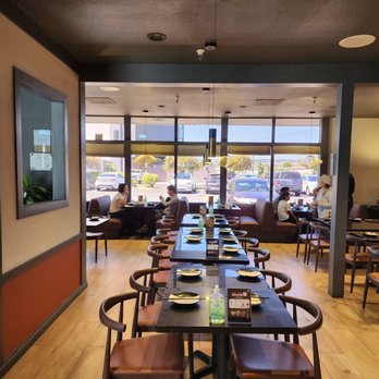 Ping’s Bistro - a dining room with tables and chairs - Chinese Near Me - San Mateo, California Ping’s Bistro - a dining room with tables and chairs - Chinese Near Me - San Mateo, California
