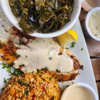 Harry's Seafood Bar & Grille - Blackened redfish, collard greens, Creole rice - Seafood Near Me - St Augustine, Florida