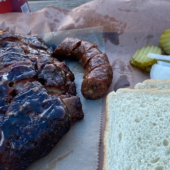 Ridgewood Brothers’ BBQ - a grilled pork sandwich with a side of pickles and a pickle - Barbeque Near Me - Russellville, Arkansas Ridgewood Brothers’ BBQ - a grilled pork sandwich with a side of pickles and a pickle - Barbeque Near Me - Russellville, Arkansas