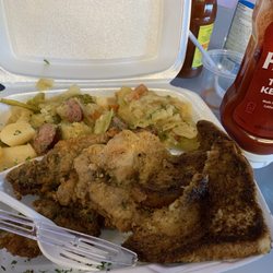 Aunt Sandra's Boudian and More - Pork chops, cabbage with potatoes and sausage, slice of bread