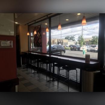 Dunkin' - Bar seating with a view. - Donuts Near Me - Garden City Park, New York