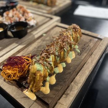 Culichi Town - a sushi roll on a cutting board - Sushi Bars Near Me - Sylmar, California Culichi Town - a sushi roll on a cutting board - Sushi Bars Near Me - Sylmar, California