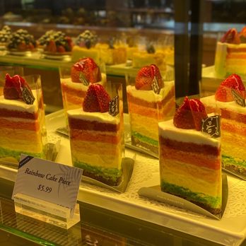 Paris Baguette - Rainbow Cake slices on display 6/11/20 - Coffee & Tea Near Me - Duluth, Georgia