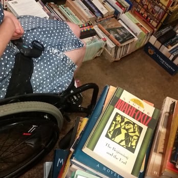 West Side Books - barely squeezing by on our way out to the "accessible" entrance! - Bookstores Near Me - Denver, Colorado
