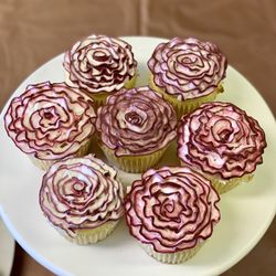The Little Things Bakery - Custom decorated passionfruit cupcakes with passionfruit filling.
