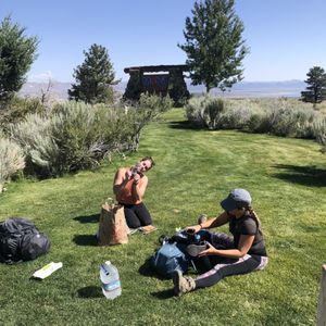 Photo of Tioga Gas Mart & Whoa Nellie Deli - Lee Vining, CA, United States. Using the grass on the parking lot to pack up our bags for a backpacking trip