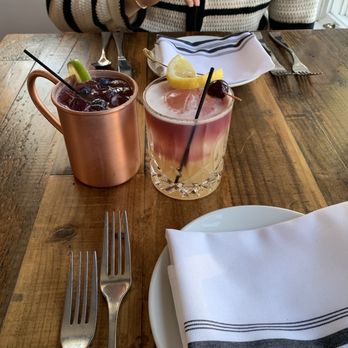 Porcelli’s - DOCG Reserve Sour (right) and Blueberry Rosemary Mule (left) - Italian Near Me - Bar Harbor, Maine Porcelli’s - DOCG Reserve Sour (right) and Blueberry Rosemary Mule (left) - Italian Near Me - Bar Harbor, Maine