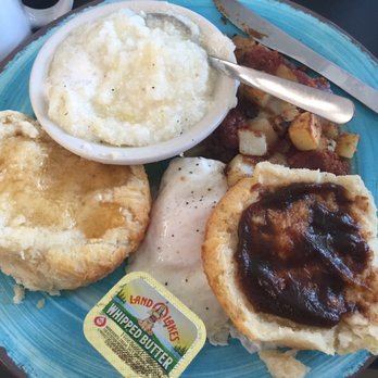 Buttered Biscuit - Two over medium eggs, grits, corn beef hash and a biscuit w/honey on one side and apple butter on the other. Wow it was good. - Breakfast & Brunch Near Me - Waynesville, North Carolina