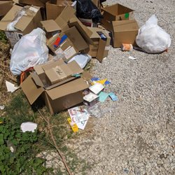 Vapor Bar & Smokeshop - Wizard's Vape Shop illegally dumping litter behind their store and ruining the community they operate in
